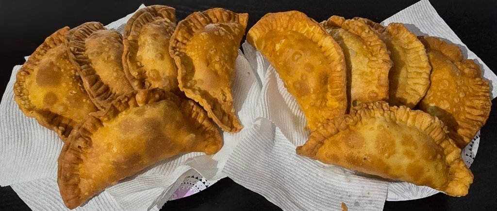 What Is A Pastelito? A Pastelito, also refered to as an empanada, is a delicious and crispy fried turnover that features a variety of savory fillings, all carefully wrapped in a flaky, golden-brown dough. Often enjoyed as a snack or appetizer, Pastelitos can be filled with meats like chicken, beef, or pork, as well as vegetables and cheese, offering a delightful mix of flavors to satisfy any palate. At Papi's, we take pride in our commitment to quality; all of our Pastelitos are fried in 100% avocado oil, which not only enhances the flavor but also adds a healthier twist. Each pastry is made from scratch with fresh ingredients, ensuring that every bite is a mouthwatering experience that reflects our dedication to authentic and delicious Latin Caribbean cuisine.